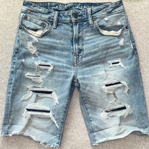 Ripped Jean shorts by American Eagle. Size 30 waist, stretch fit.